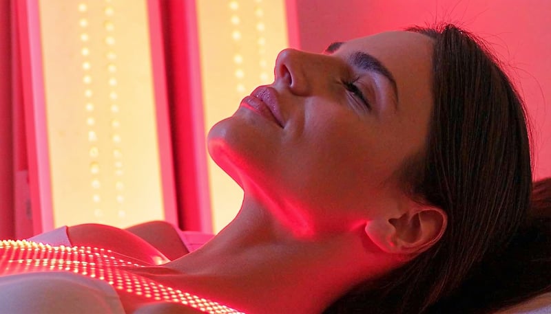 A soothing red light therapy session in progress, showcasing healing and recovery. A soothing red light therapy session in progress, showcasing healing and recovery.